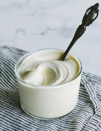 a small clear cup of creme fraiche