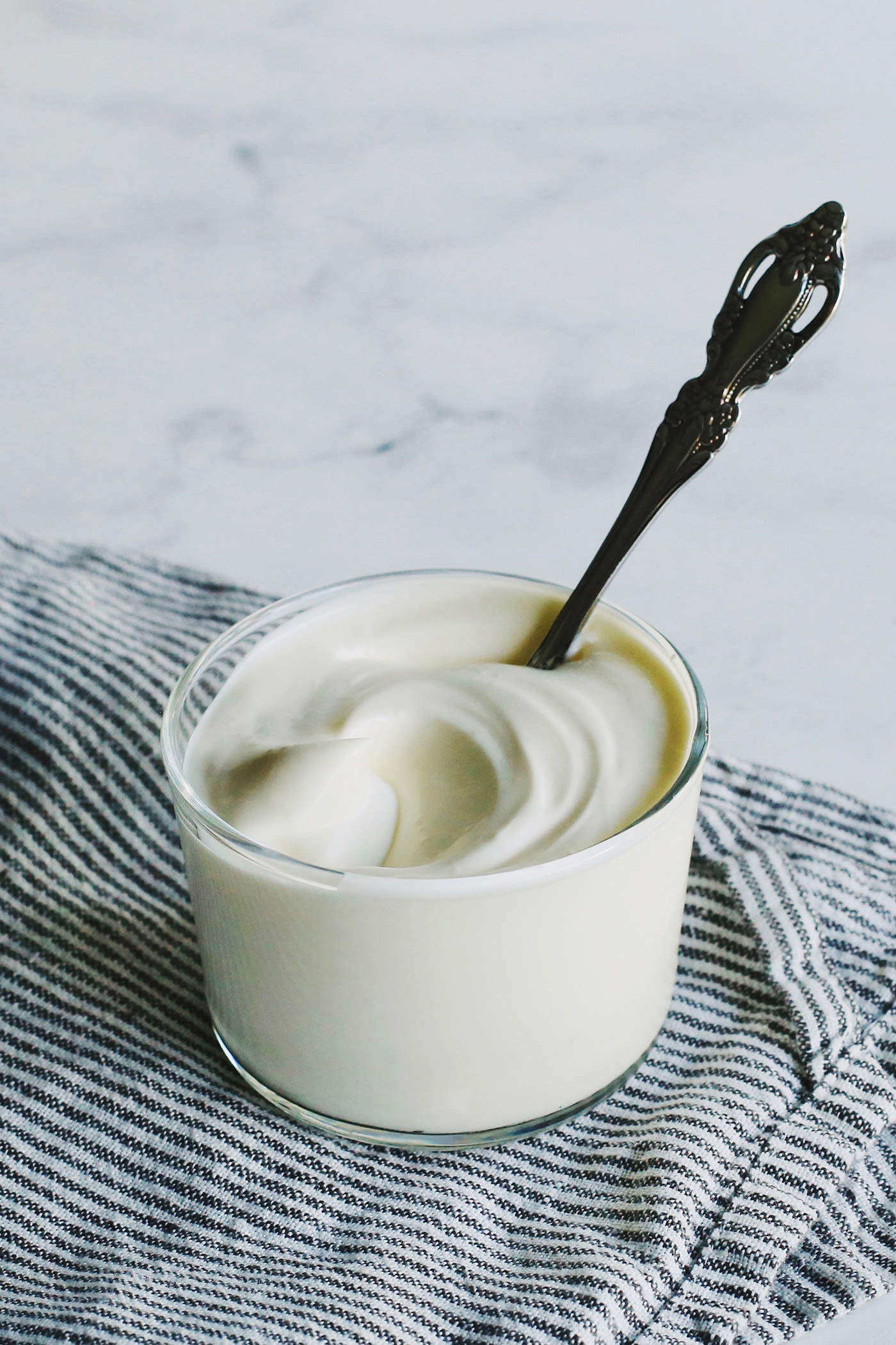 a small clear cup of creme fraiche