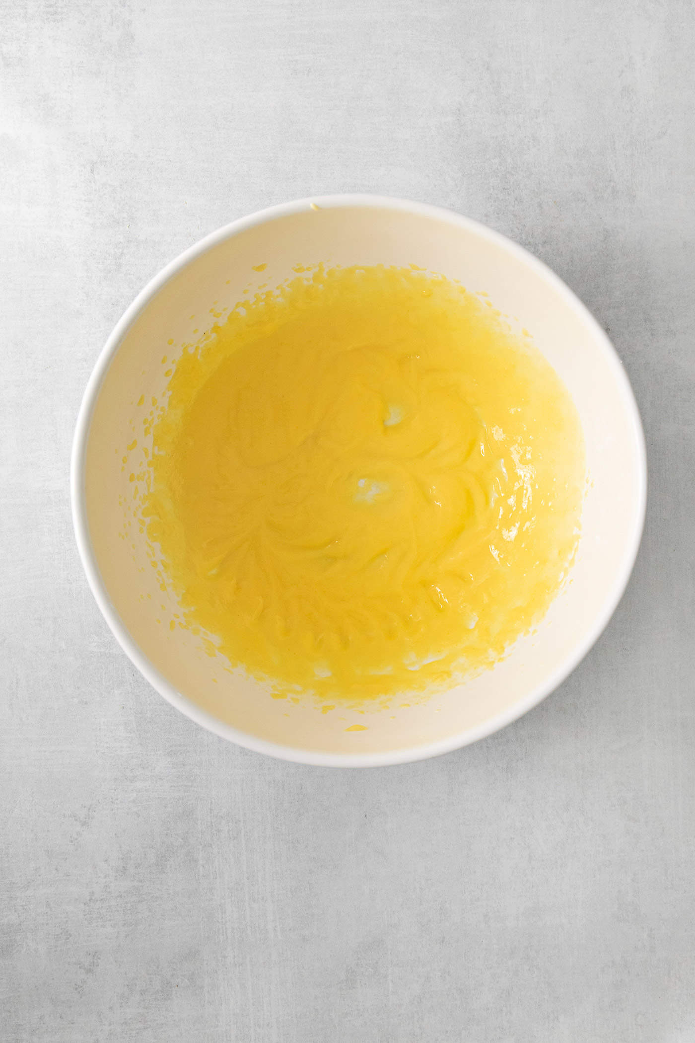 A bowl of pudding is shown on a white background.