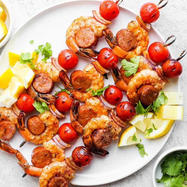grilled kabobs with shrimp and sausage, on a white plate