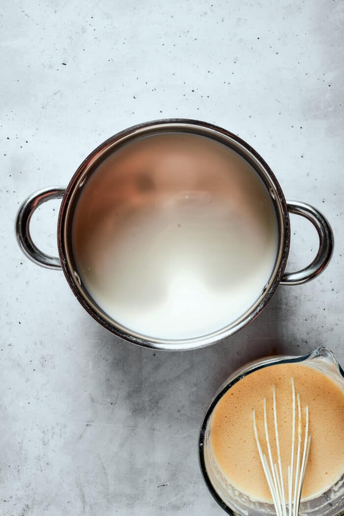 A top down view of a pot of milk.