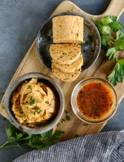 Cowboy butter on a wood board: in a bowl, formed into a log, and melted