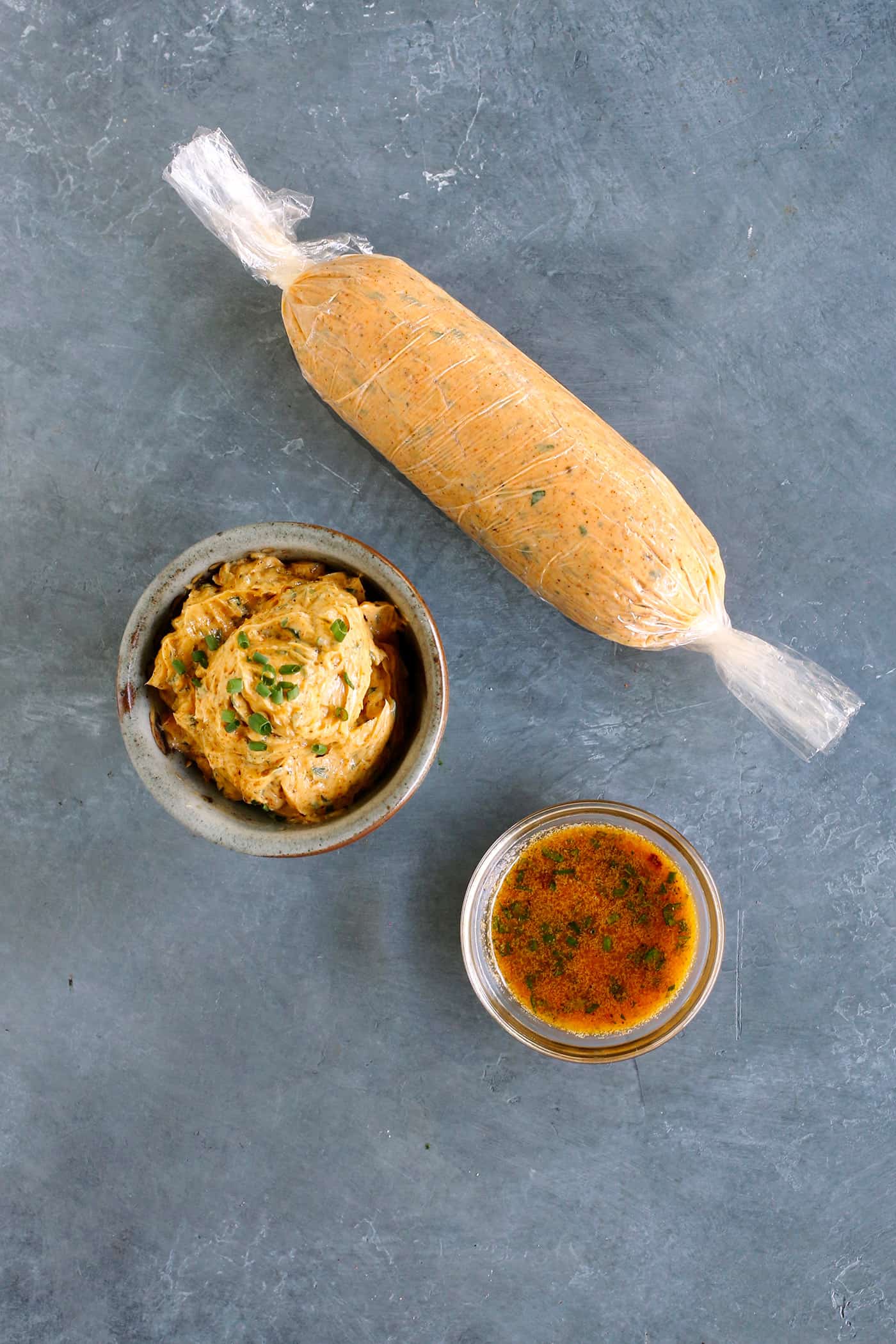 3 different ways to serve cowboy butter: soft in a bowl, chilled in a log, and melted