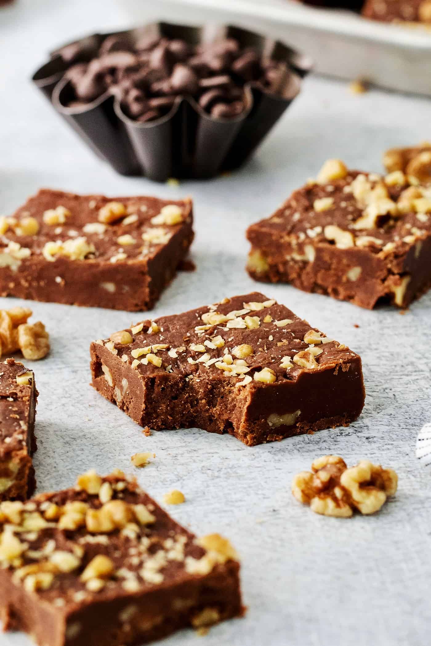 Pieces of Fantasy Fudge are shown on a white background with a bite taken out of a piece.