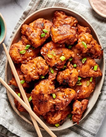 overhead photo of mochiko chicken on an oval platter