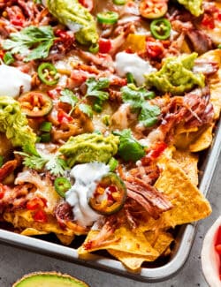 a sheet pan of baked nachos