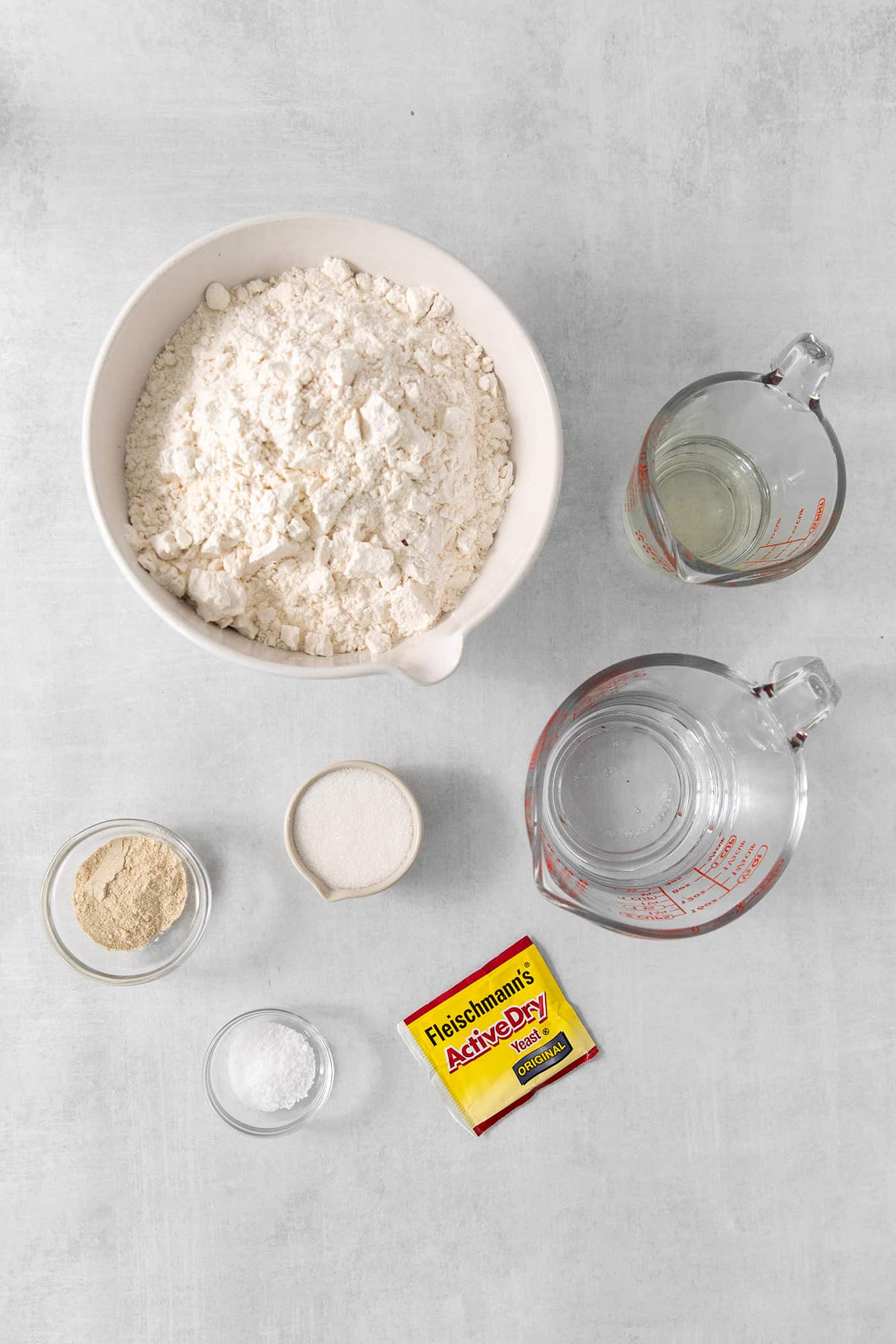 Ingredients needed to make rhodes rolls: flour, yeast, diastatic malt powder, salt, sugar, water.