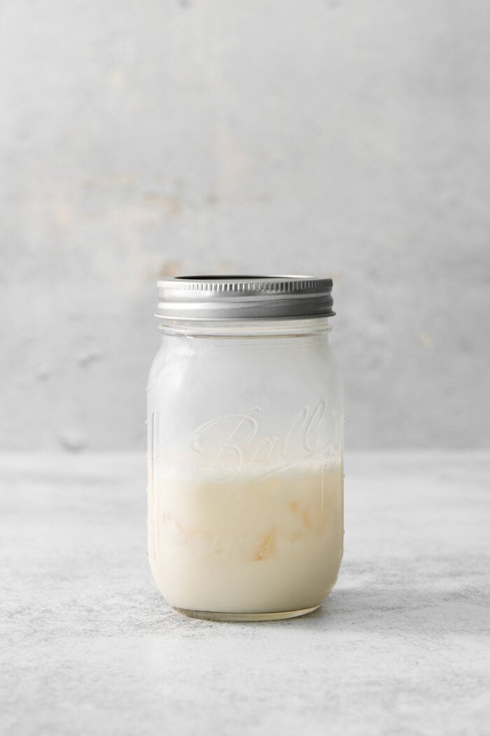 A mason jar holds the mix for salted nut roll shots.