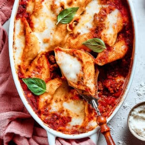 shell pasta stuffed with meat and cheese in a baking dish