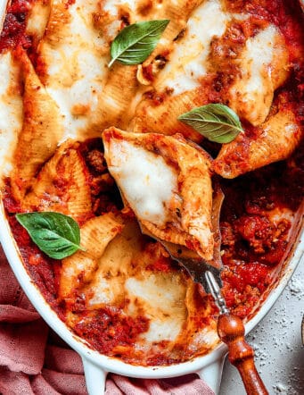 shell pasta stuffed with meat and cheese in a baking dish