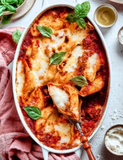 overhead photo of shell pasta stuffed with meat and cheese in a baking dish