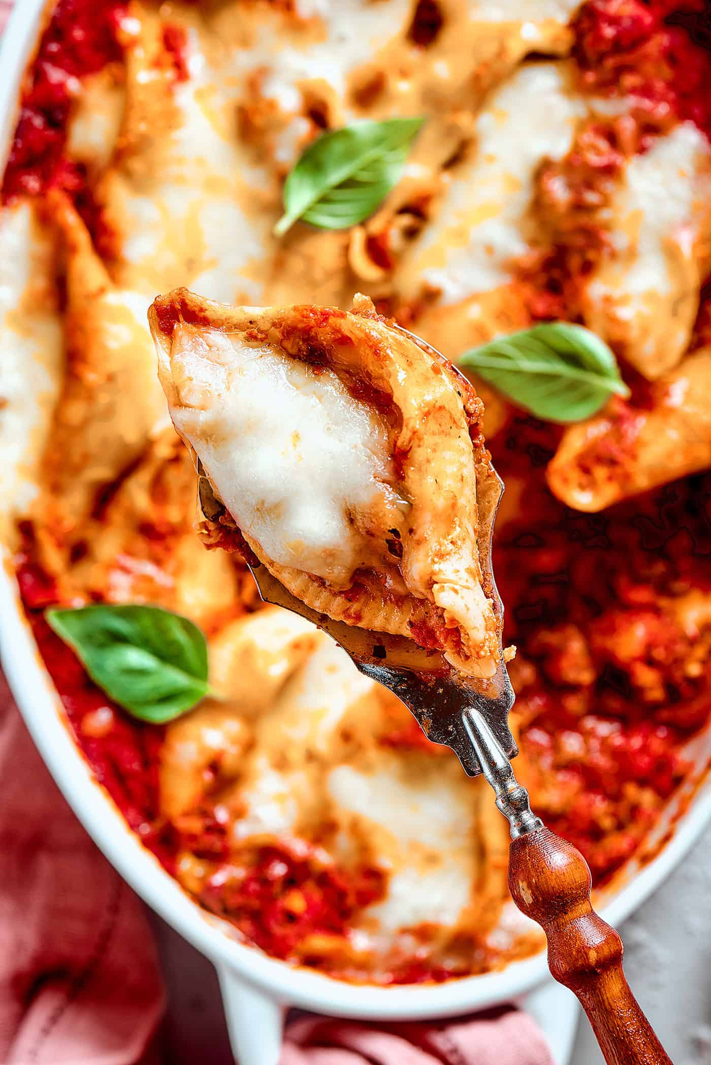 close-up of a shell pasta stuffed with meat and cheese