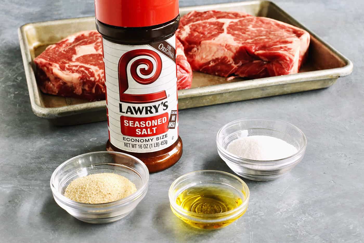 Ingredients are shown for sugar grilled steak: steak, Lawry's seasoning, olive oil, salt, and sugar.