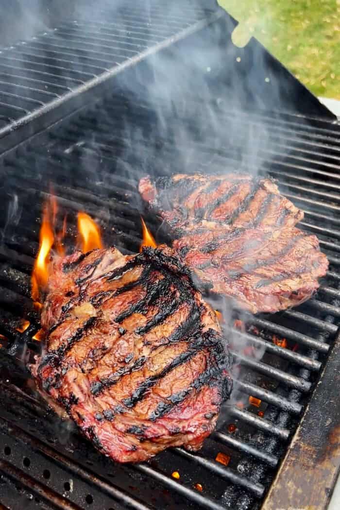 Sugar grilled steak cooks on the grill.