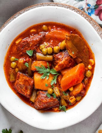 mulligan stew in a white bowl