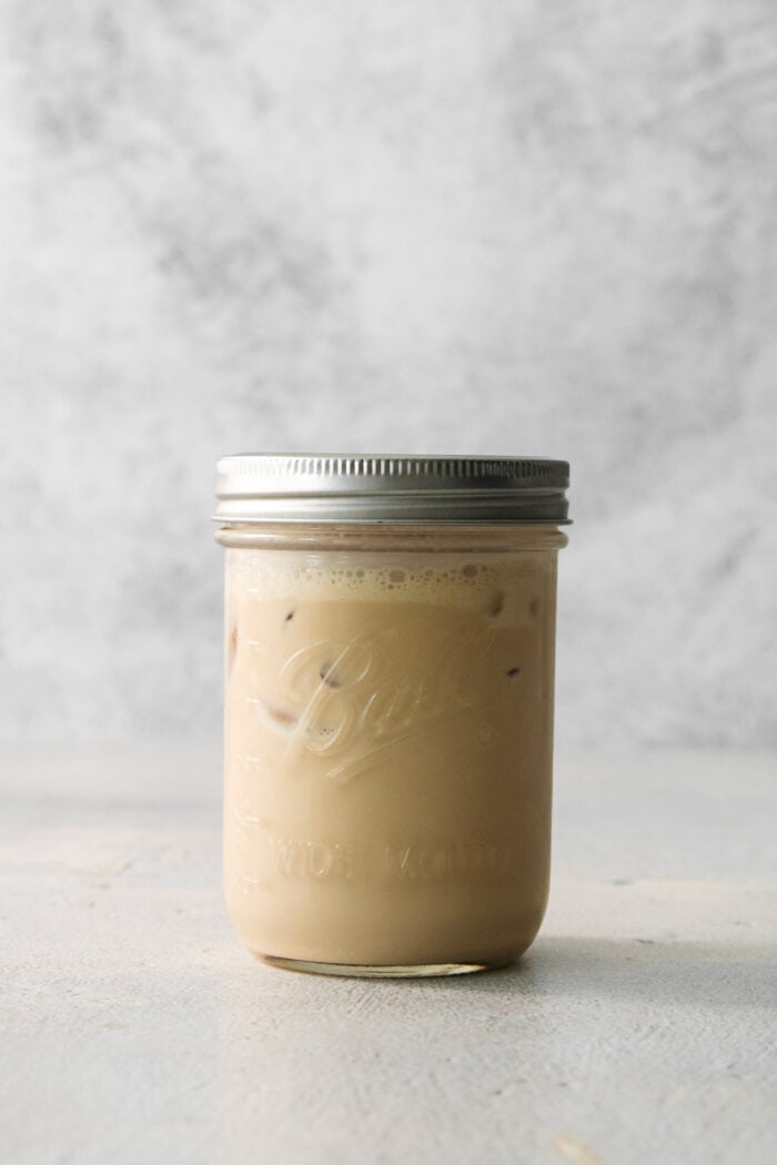 A glass jar of Brandy Alexander.