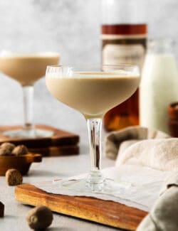 Glasses of Brandy Alexander on a cutting board.