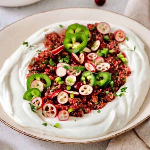 A bowl of cranberry jalapeno dip.