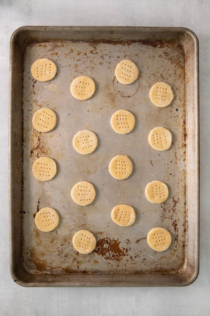 A metal tray of cream wafer cookies.