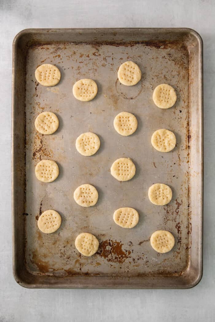A metal tray of cream wafer cookies.