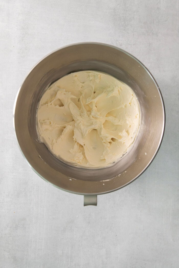 A metal bowl of buttercream filling is shown.