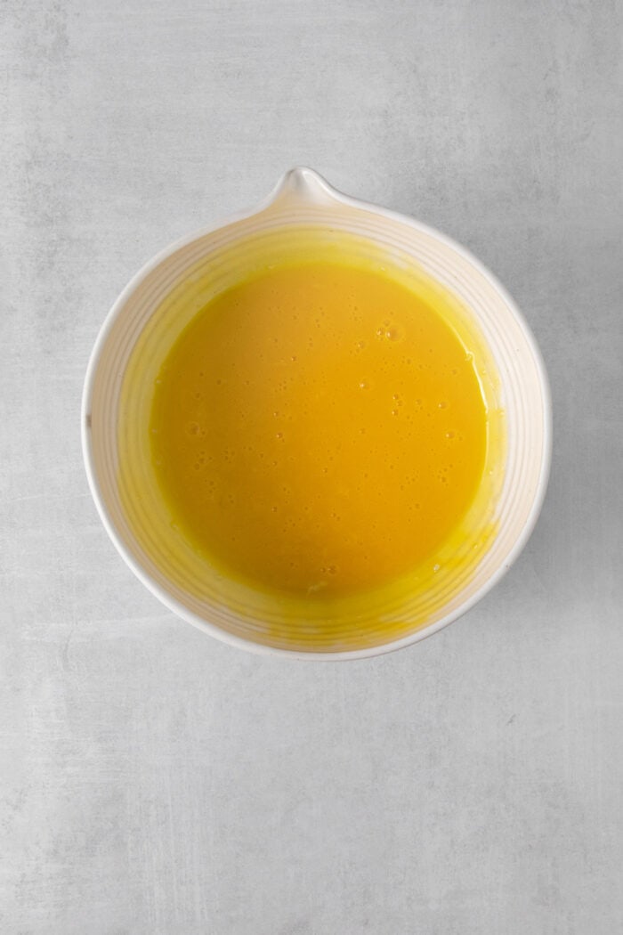 A white bowl filled with egg yolks.