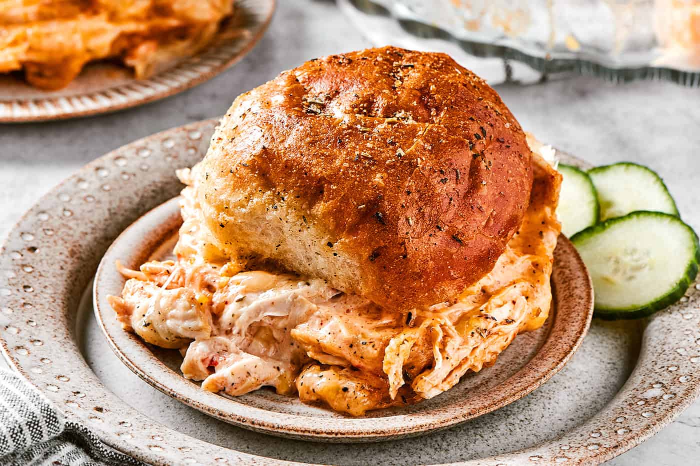 a buffalo chicken slider sandwich on a plate