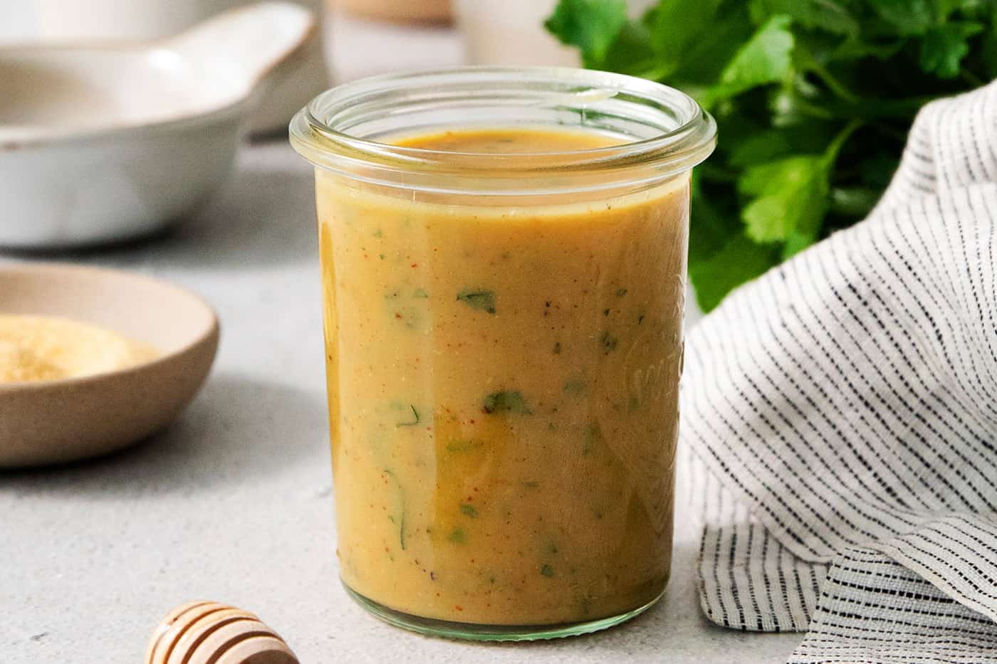 A glass jar holds honey mustard dip.