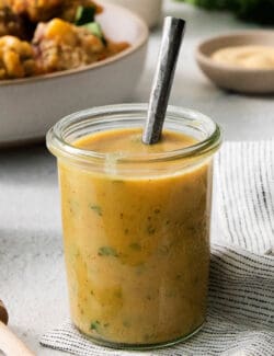 A glass jar holds honey mustard dip.