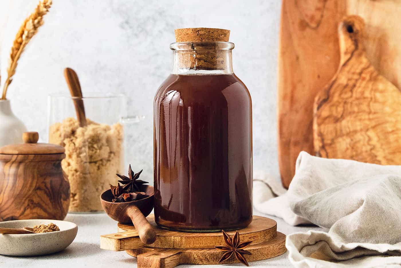 a bottle of homemade chai concentrate plus brown sugar and spices