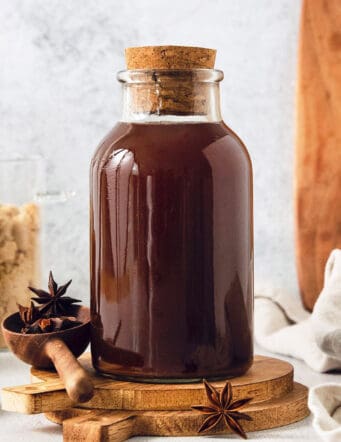 a bottle of homemade chai concentrate plus brown sugar and spices
