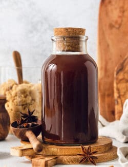 a bottle of homemade chai concentrate plus brown sugar and spices