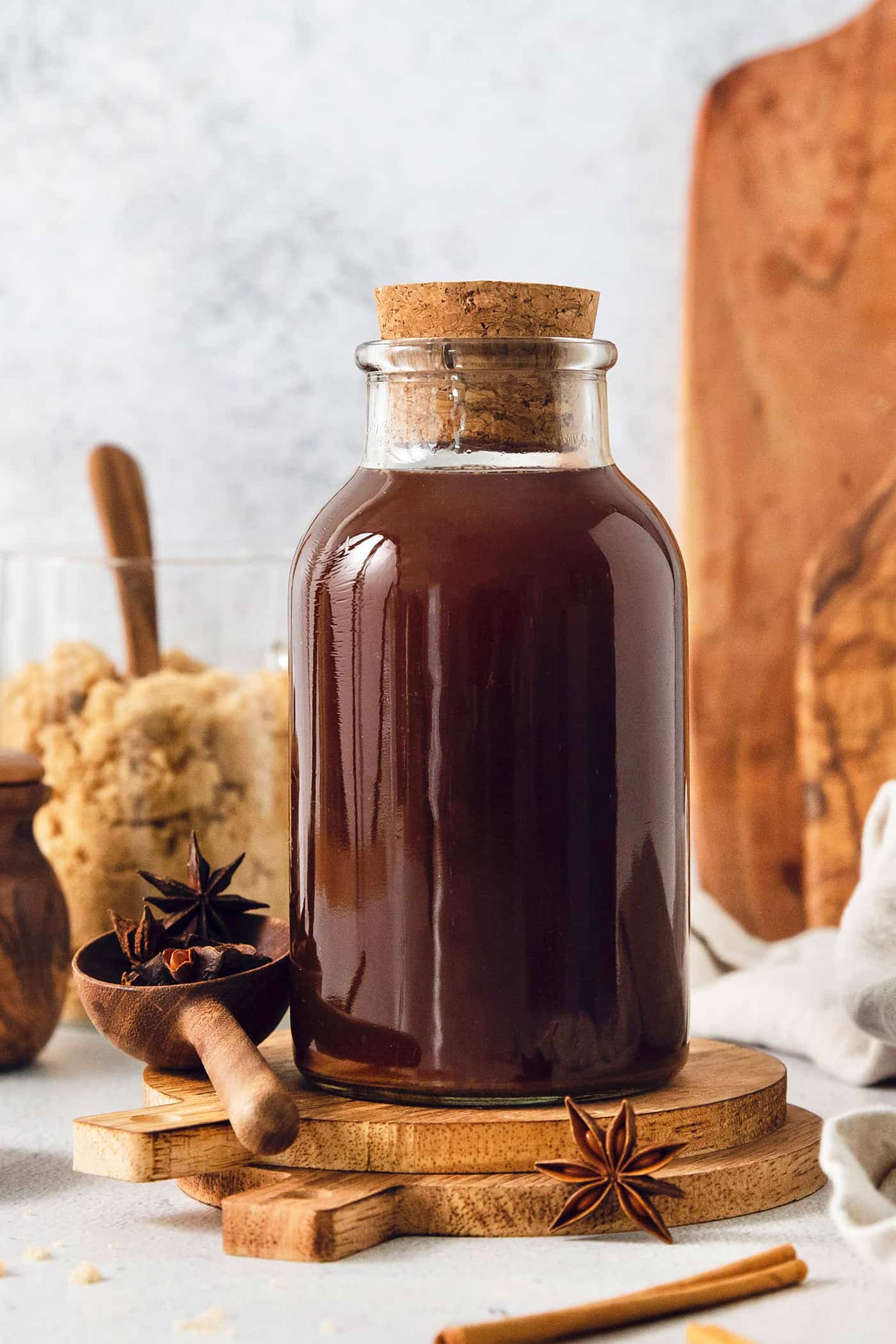 a bottle of homemade chai concentrate plus brown sugar and spices