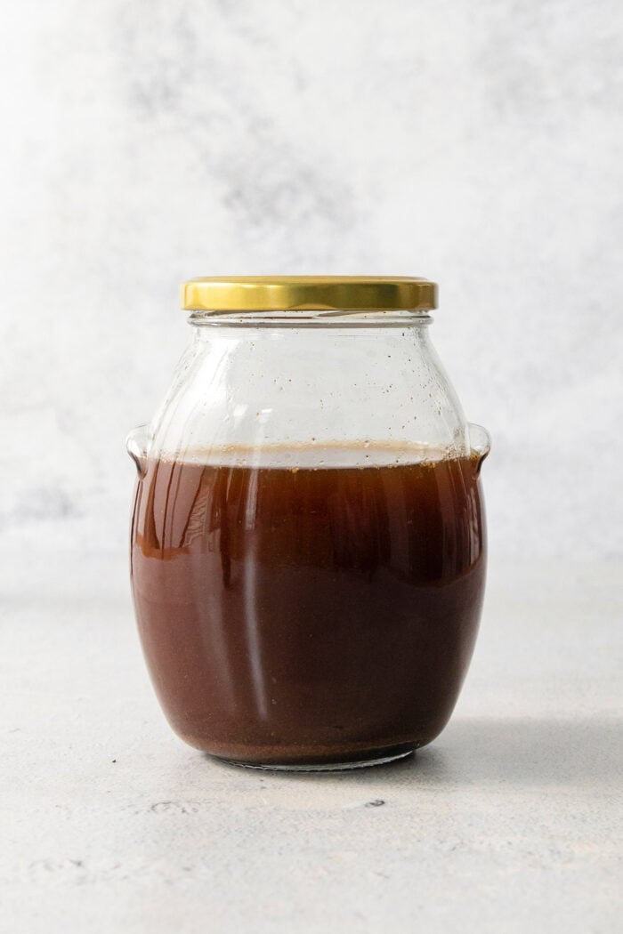 cooled chai concentrate in a jar with a lid