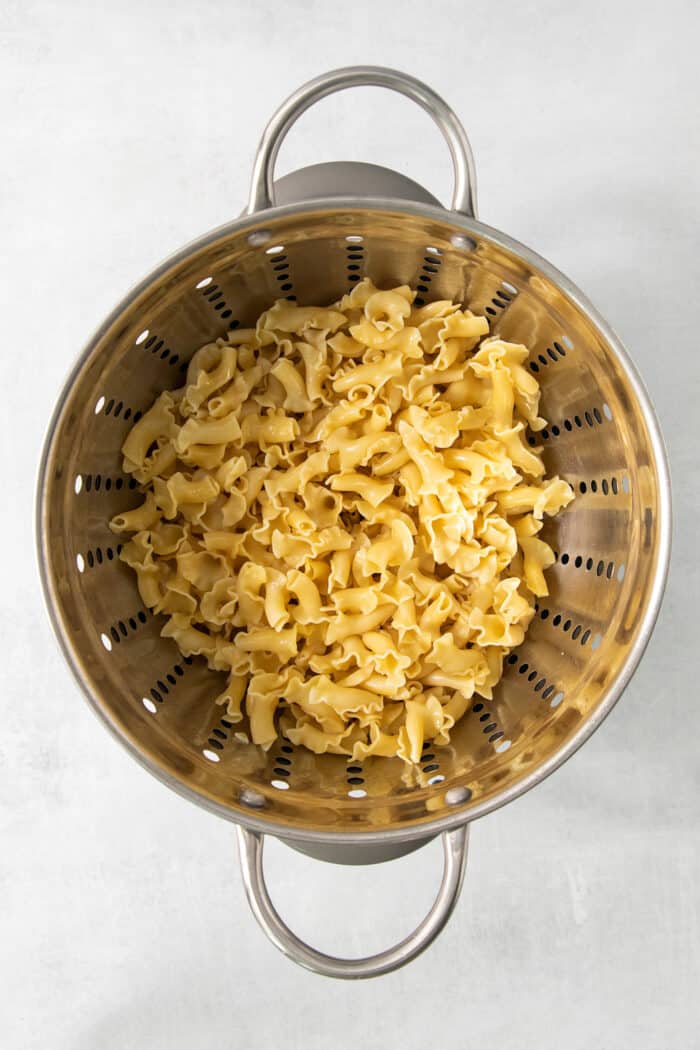 Drained pasta in a colander.