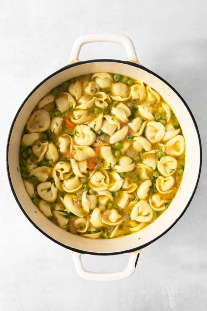 Tortellini is added to the broth for lemon chicken tortellini soup.