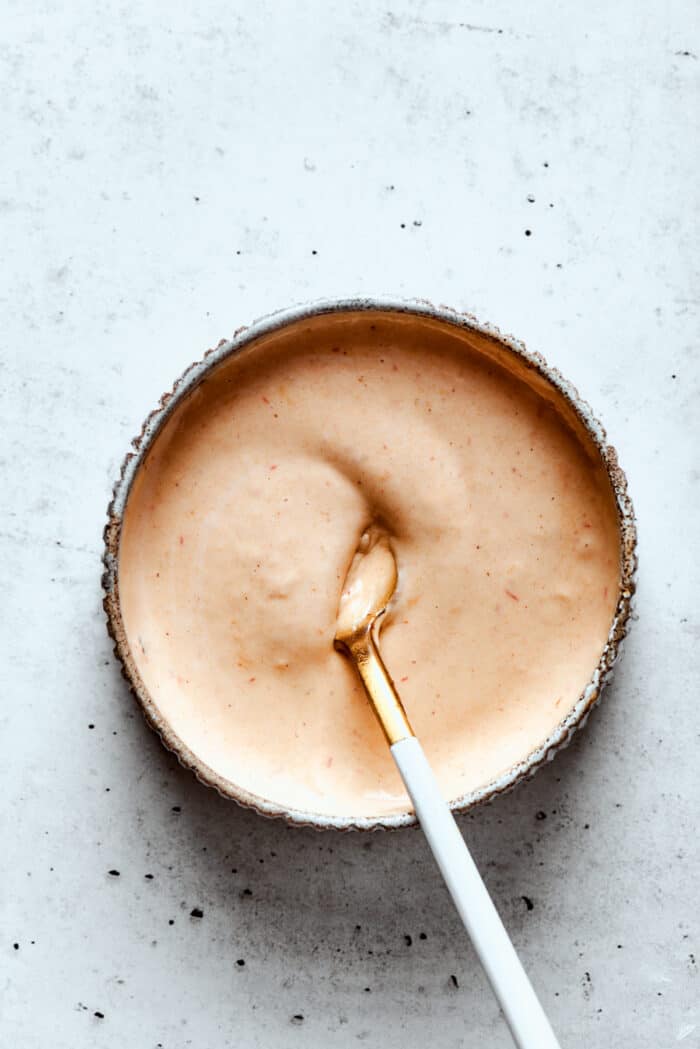The drizzle sauce is mixed in a bowl.