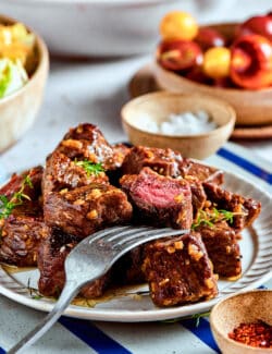 steak bites with garlic butter on a plate