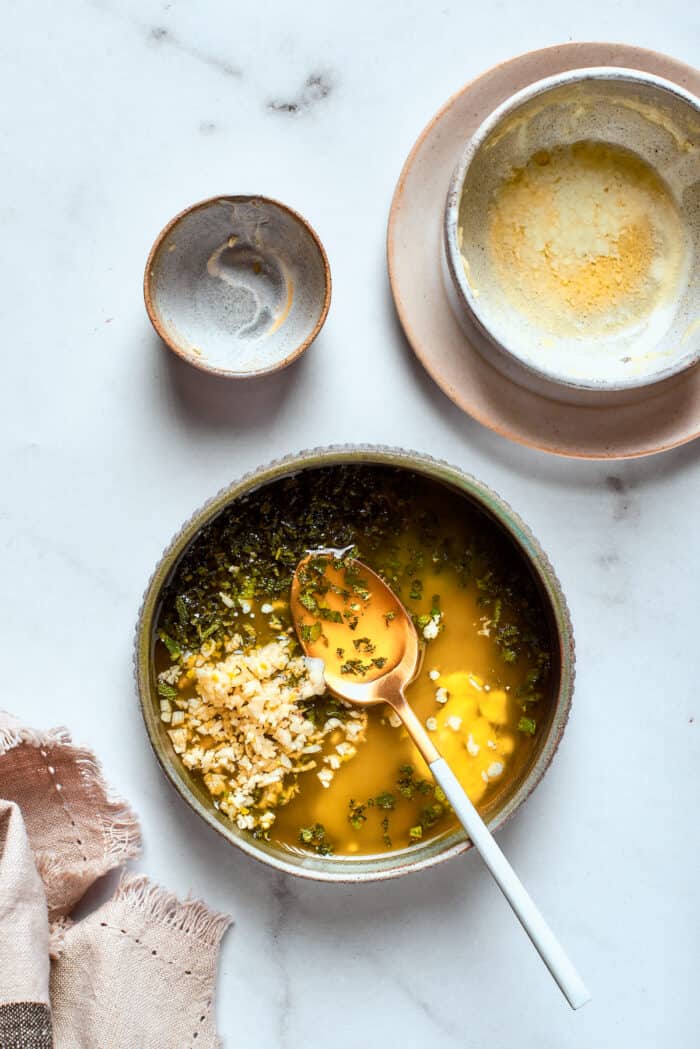 The savory seasonings for the roast are mixed together in a bowl.