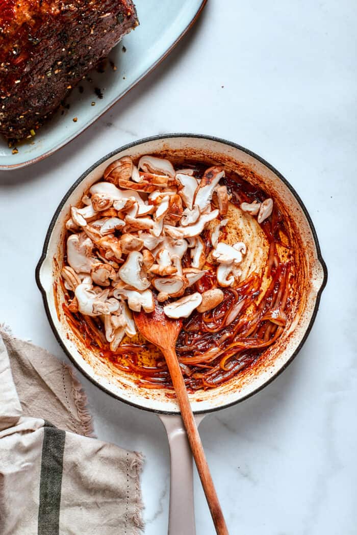 Mushrooms are added to the gravy.
