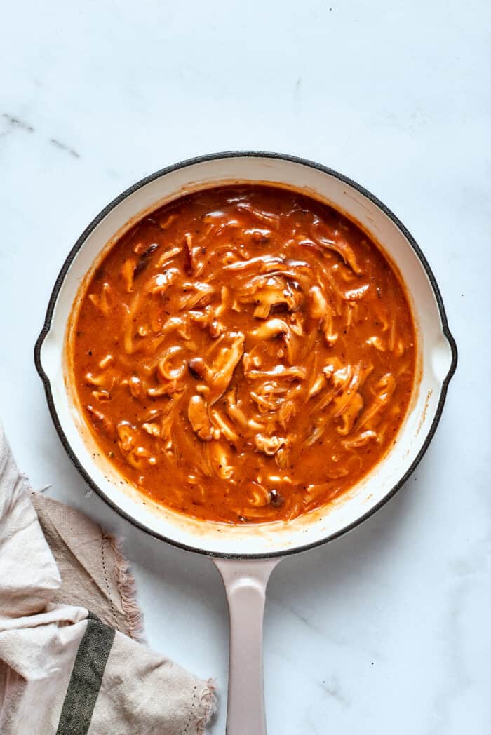 Mushrooms are seen in the gravy.