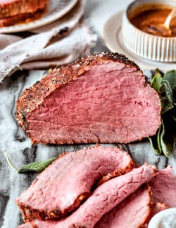 A top round roast with slices cut from it.