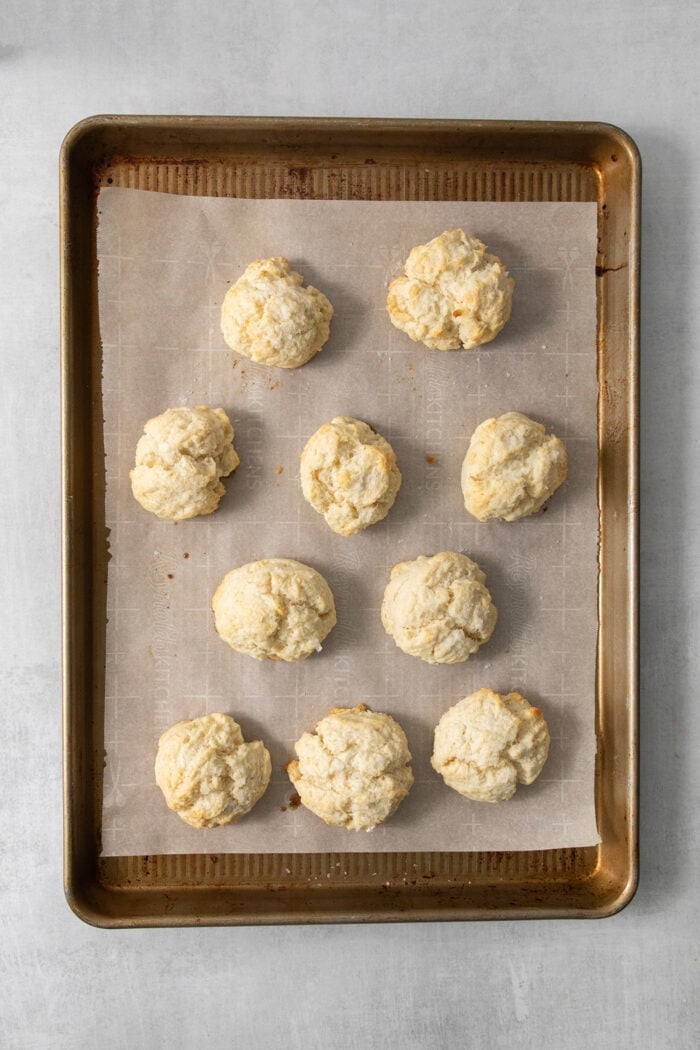The biscuits are shown on the baking sheet after being baked.
