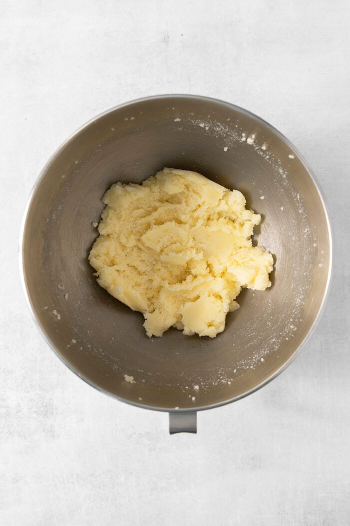 Lemon crinkle cookie dough in a bowl.