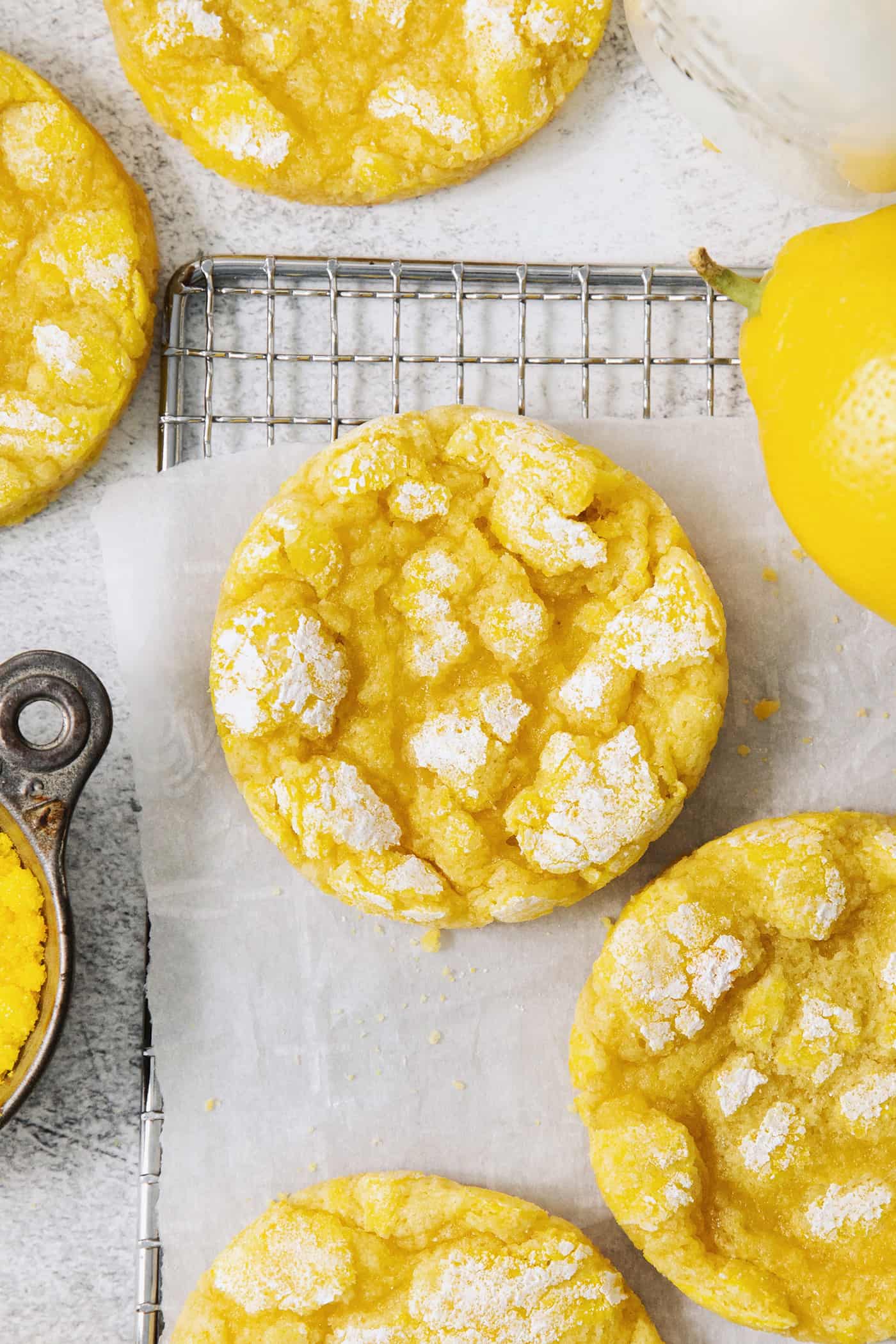 Powdered sugar tops lemon crinkle cookies.