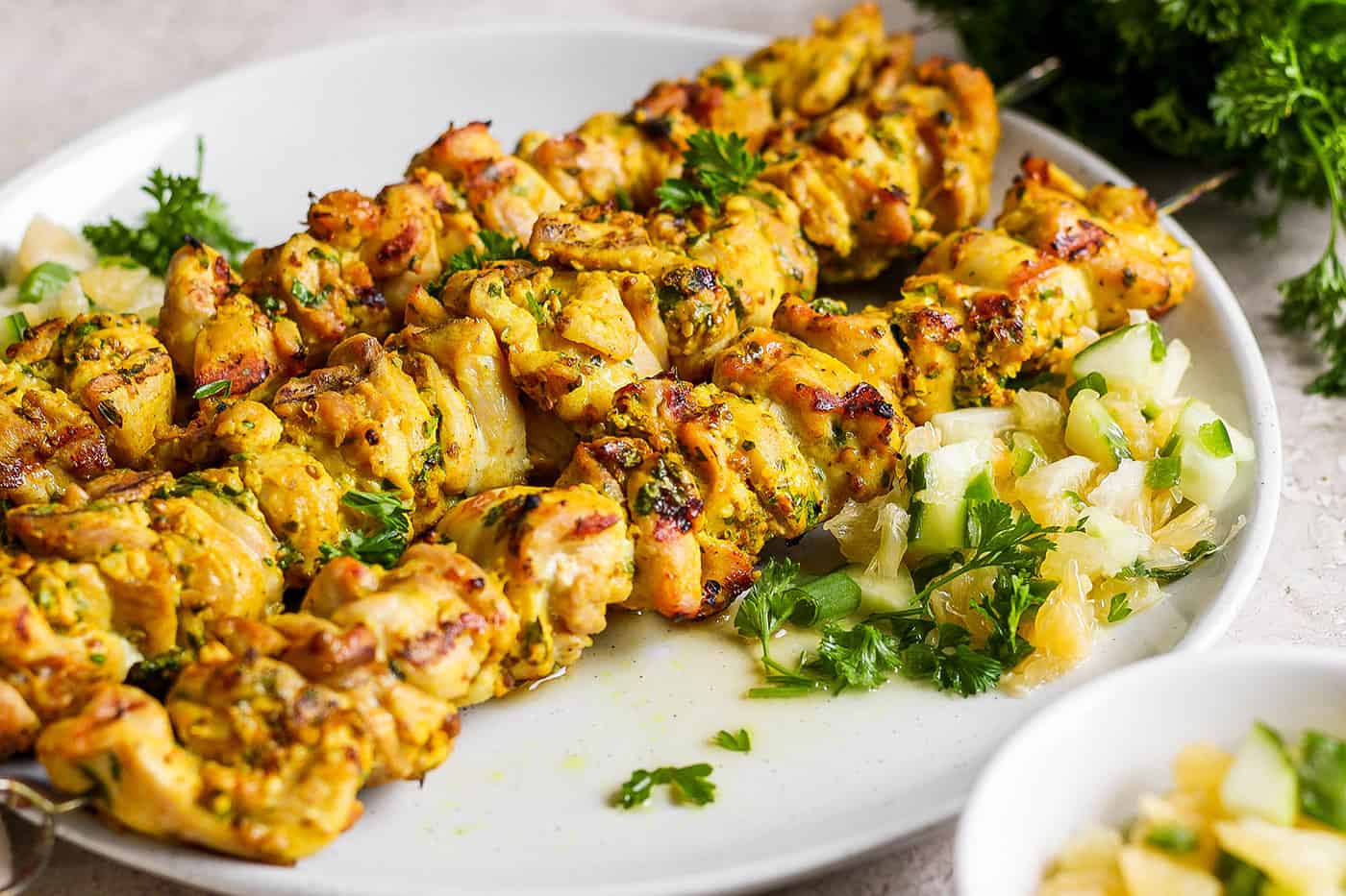 A plate of Chicken Kabobs with Meyer Lemon Salsa.