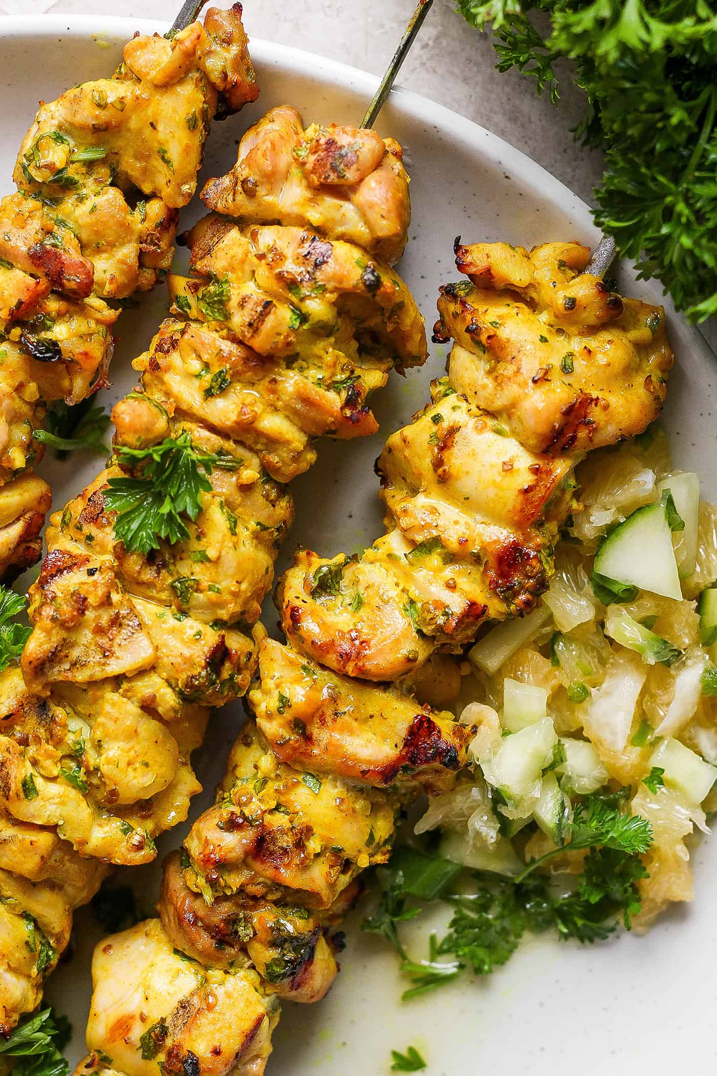 Chicken kabobs with Meyer lemon salsa are arranged on a plate