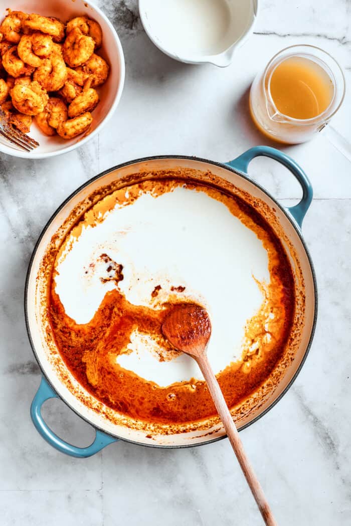 Cream is added to the red sauce.