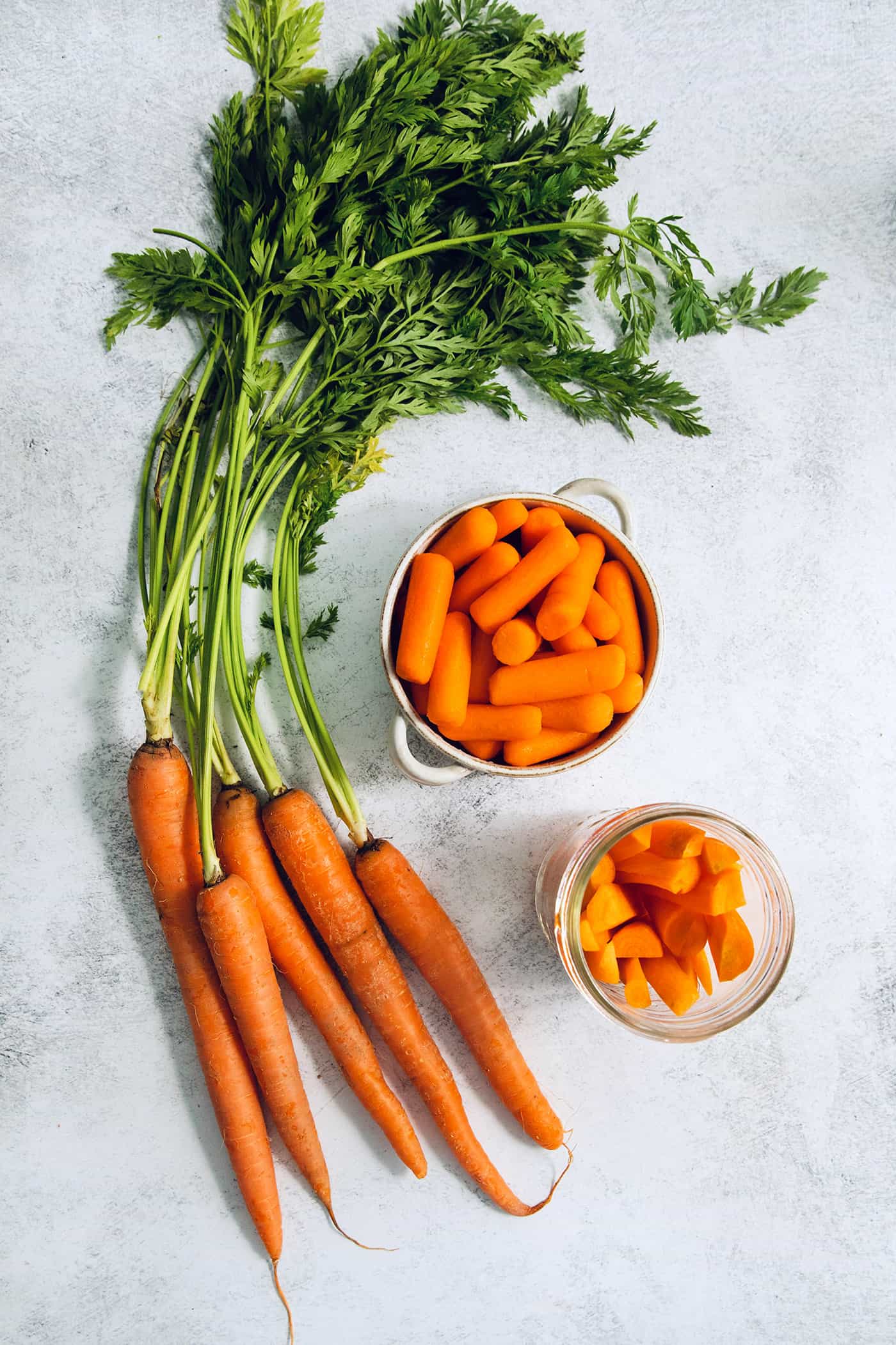 whole carrots with green tops, bagged carrots, and cut carrots