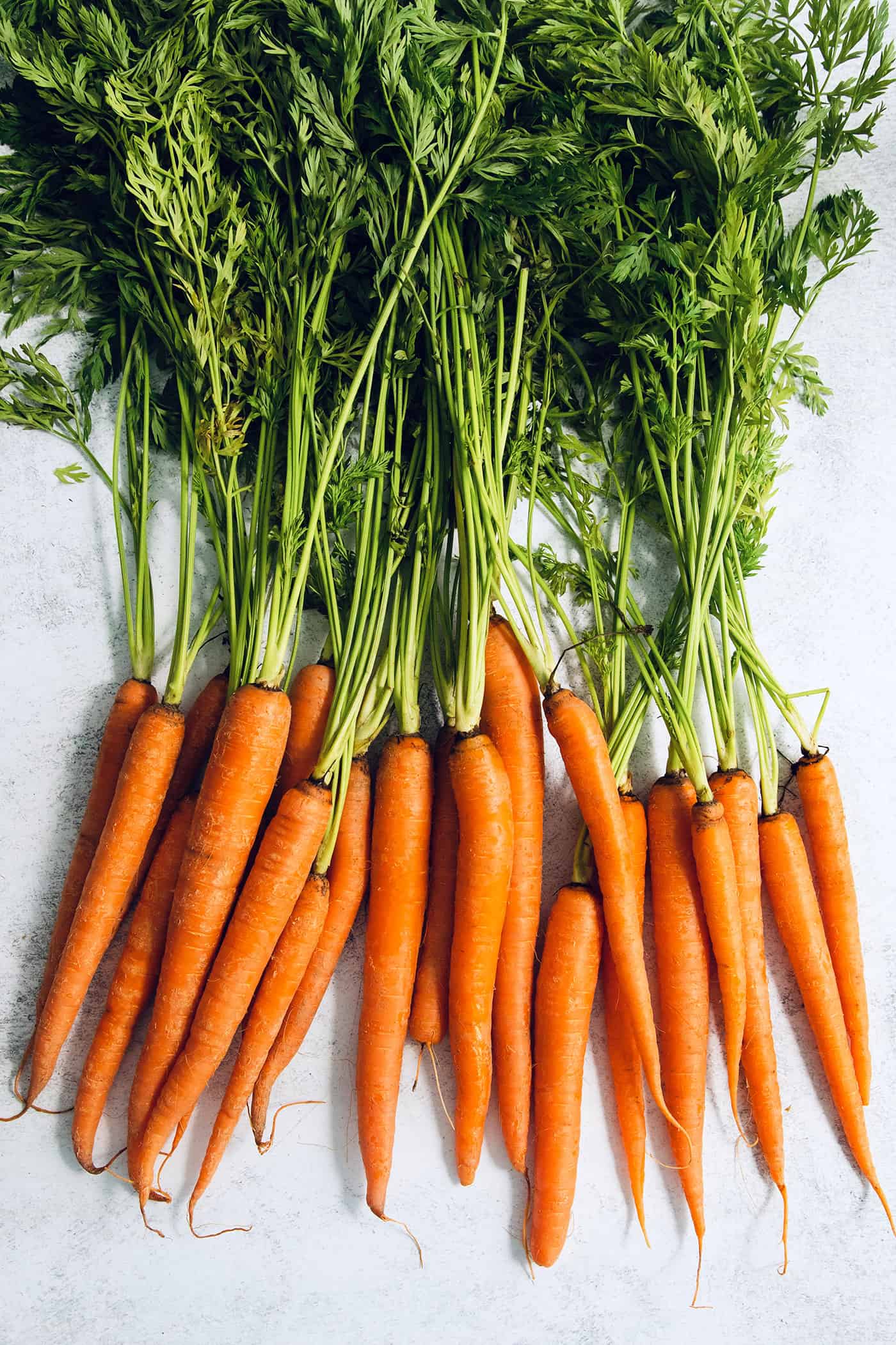 whole carrots with green tops